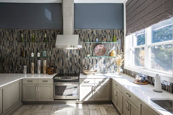 Modern kitchen with stainless steel appliances at Residences at Brookline Apartments