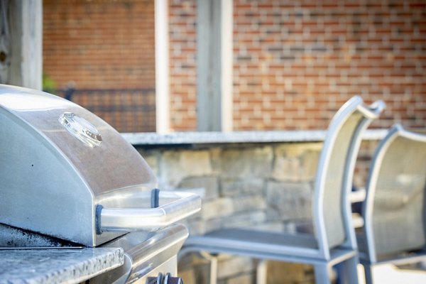 Spacious outdoor patio with stylish seating at Residences at Brookline Apartments