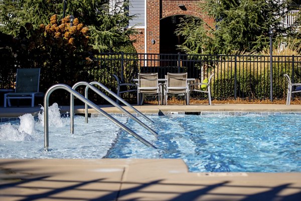 Glistening outdoor pool at Residences at Brookline Apartments, perfect for relaxation and recreation in a tranquil setting