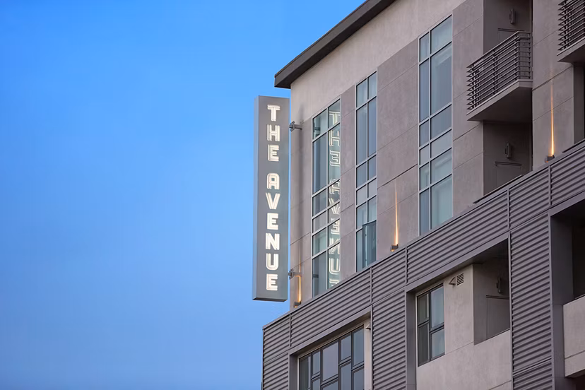 Signage at The Avenue Hollywood Apartments, luxury living in vibrant Los Angeles neighborhood