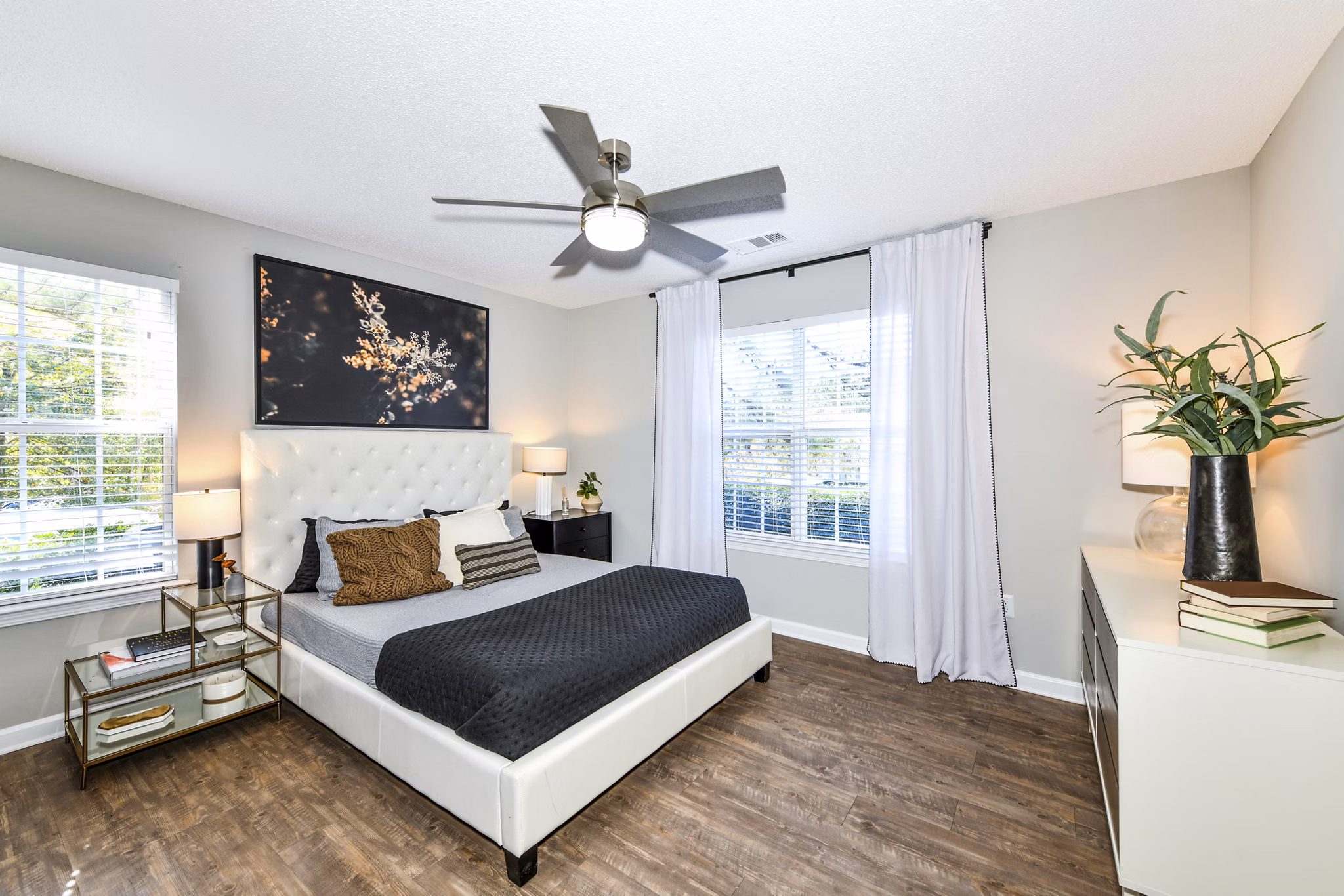 Cozy bedroom with modern furnishings at Avana Kennesaw Apartments, offering comfort and style in every corner