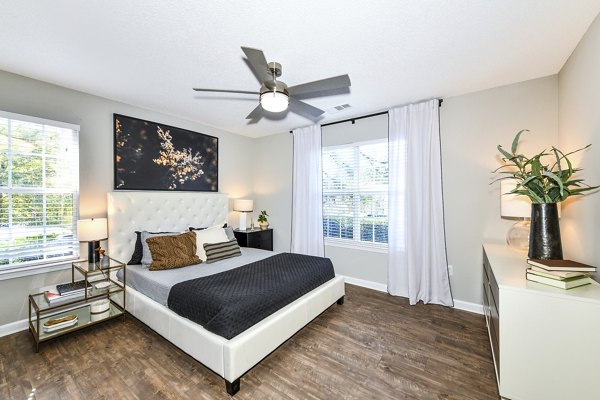 Cozy bedroom with modern furnishings at Avana Kennesaw Apartments, offering comfort and style in every corner