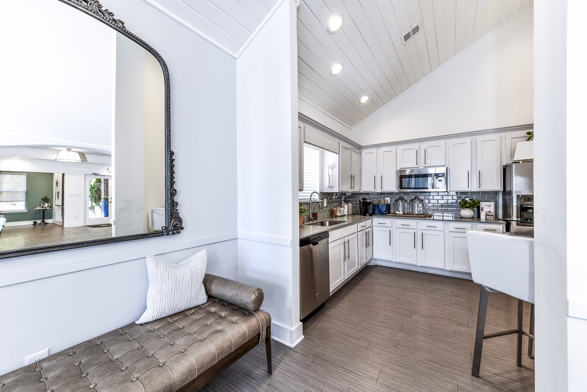 Modern clubhouse kitchen with stainless steel appliances at Avana Kennesaw Apartments, featuring open layout and ample seating for residents