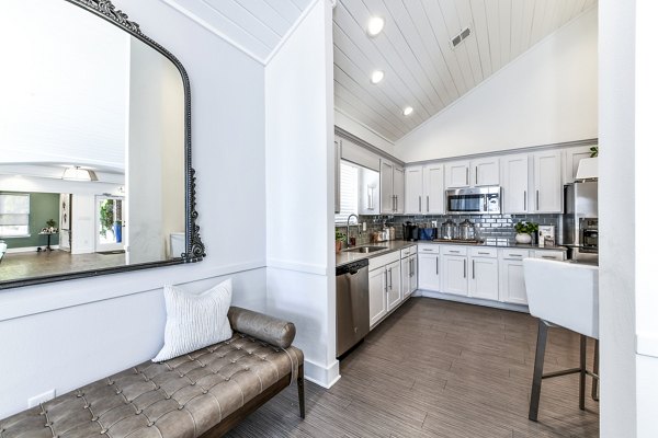 Modern clubhouse kitchen with stainless steel appliances at Avana Kennesaw Apartments, featuring open layout and ample seating for residents