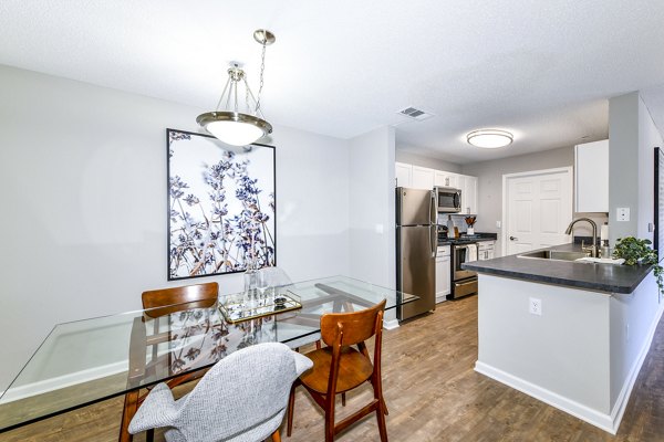 Dining room featuring modern decor and ample seating at Avana Kennesaw Apartments