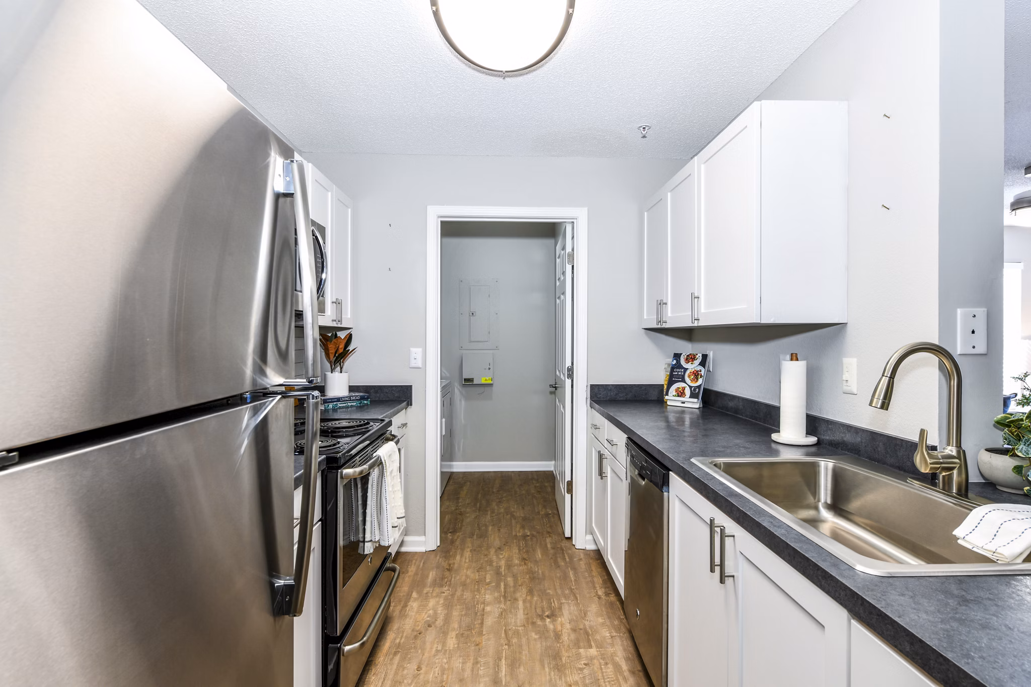 kitchen with stainless steel appliances and granite countertops in Avana Kennesaw Apartments