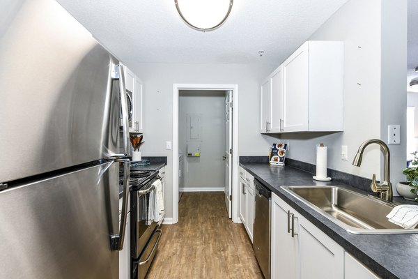 kitchen with stainless steel appliances and granite countertops in Avana Kennesaw Apartments