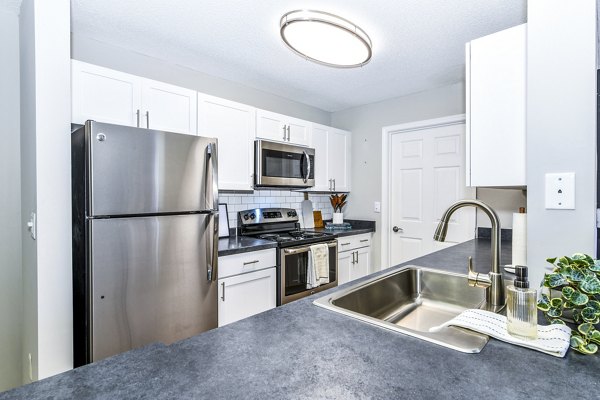 Modern kitchen with stainless steel appliances in Avana Kennesaw Apartments