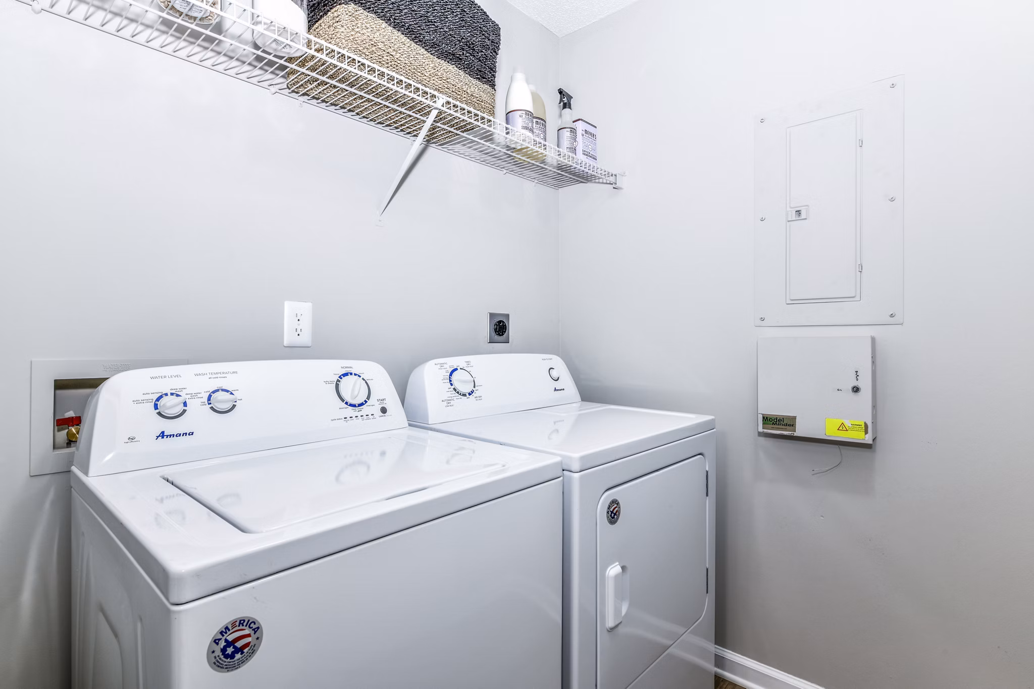 Laundry room featuring modern appliances at Avana Kennesaw Apartments in luxurious Greystar property