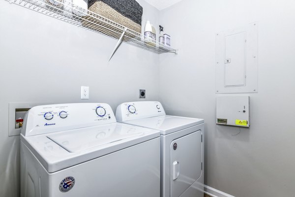 Laundry room featuring modern appliances at Avana Kennesaw Apartments in luxurious Greystar property