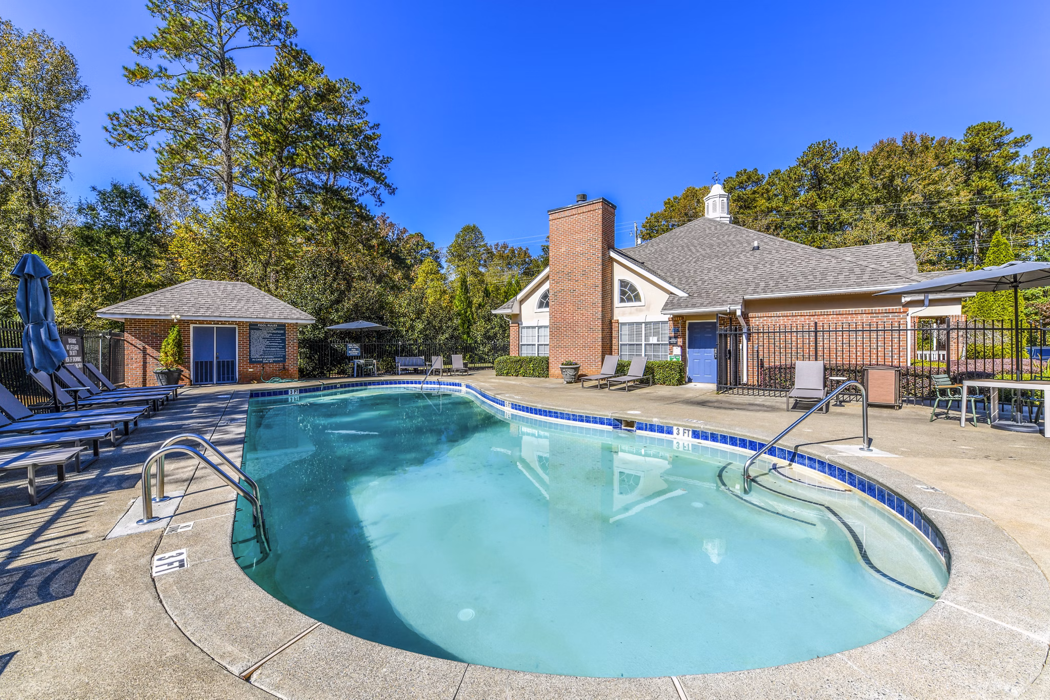 Luxurious pool with sunbathing area at Avana Kennesaw Apartments