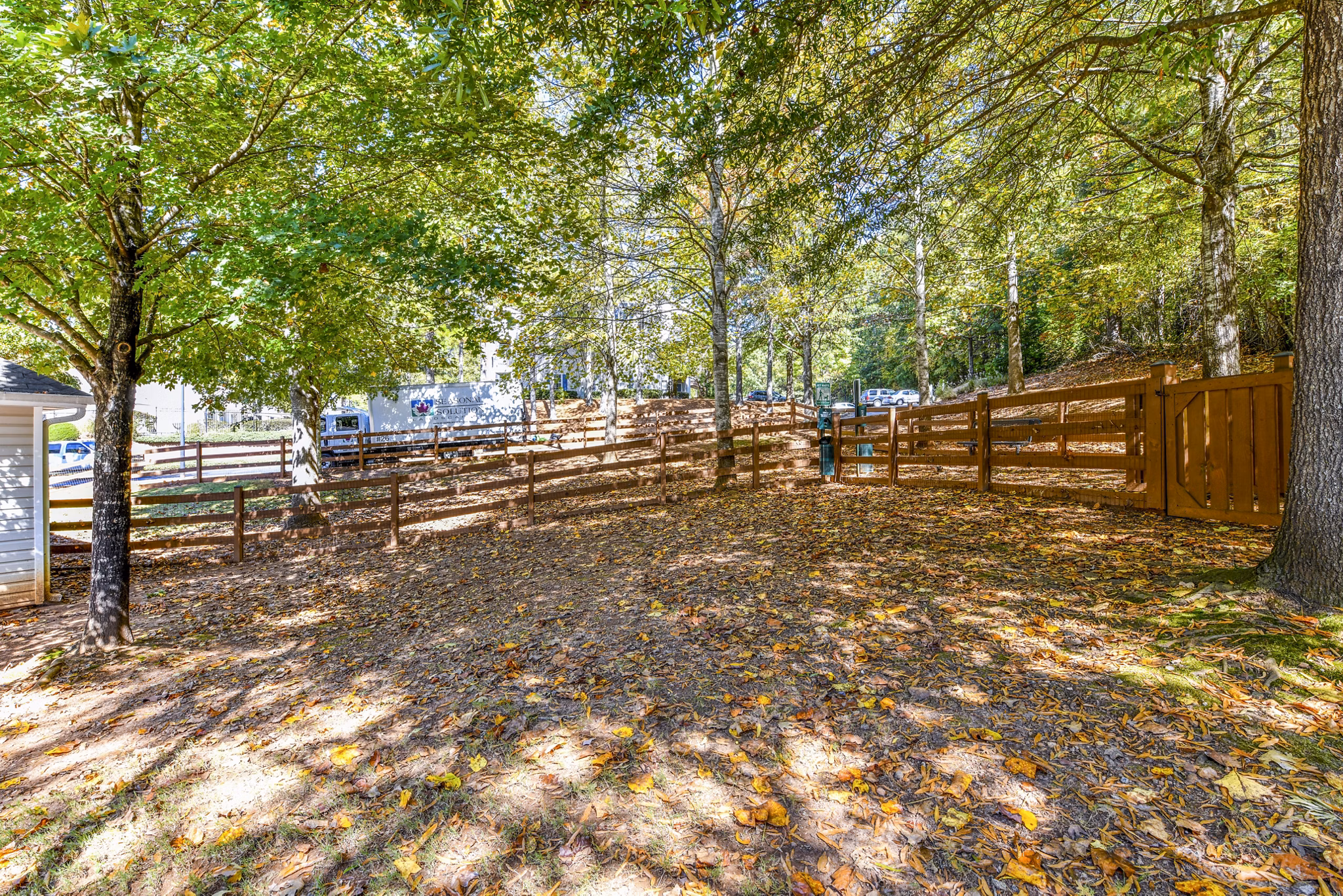 Fenced dog park with agility equipment at Avana Kennesaw Apartments