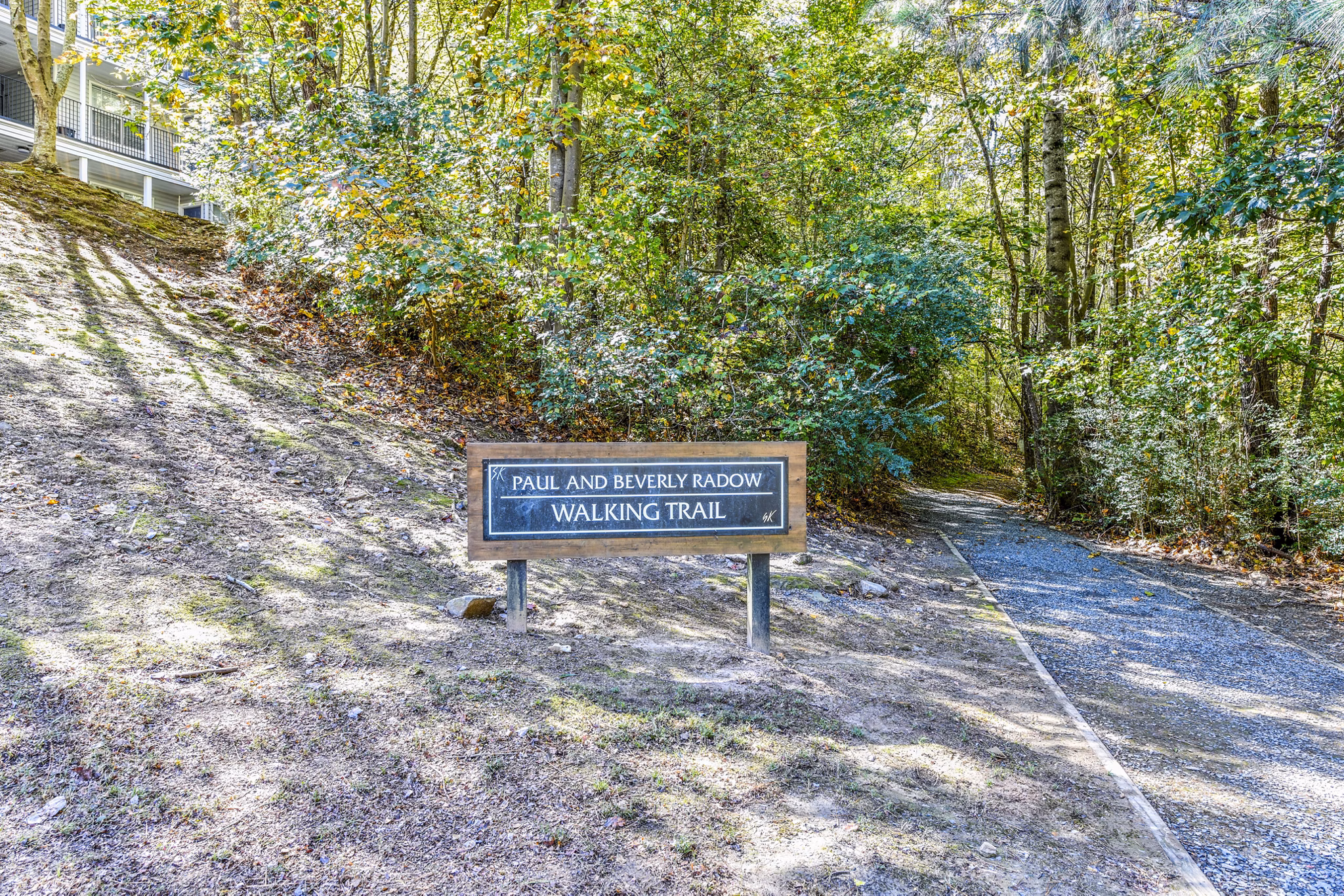 Walking trail surrounded by lush greenery at Avana Kennesaw Apartments