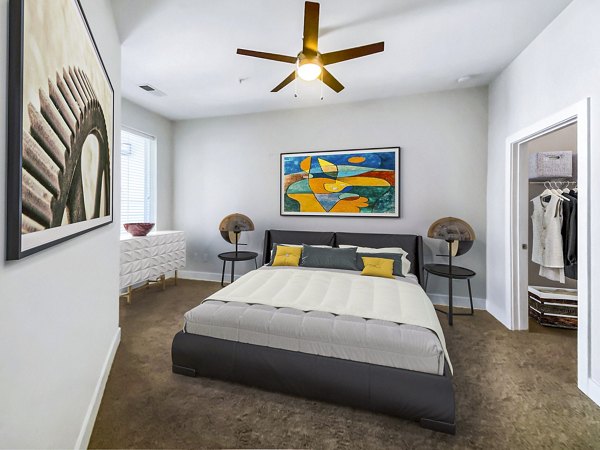 Modern bedroom with stylish decor at Presley Uptown Apartments