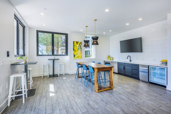 Elegant clubhouse lobby with modern furnishings at Presley Uptown Apartments, offering luxury living in the heart of the city
