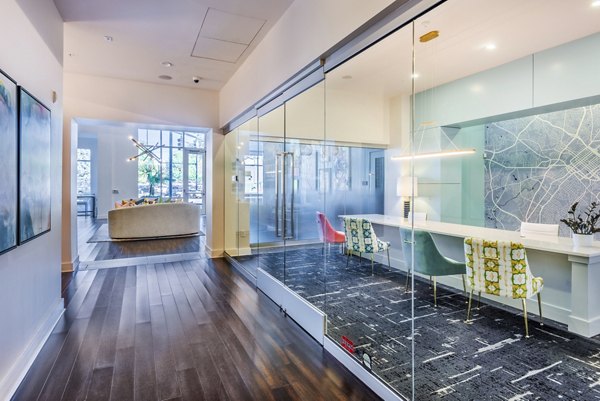 Clubhouse lobby with modern seating and decor in Presley Uptown Apartments