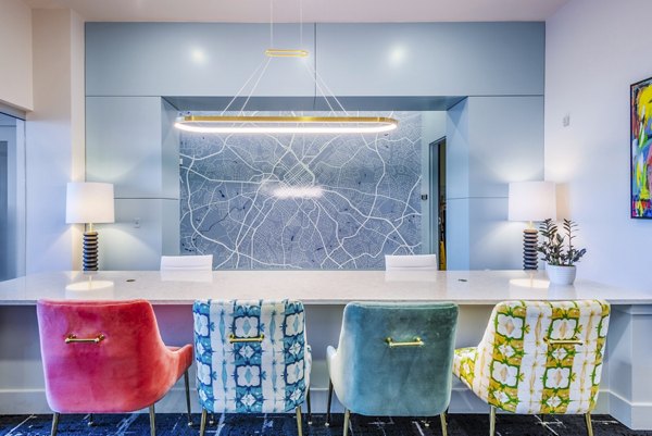 Luxury clubhouse and inviting lobby at Presley Uptown Apartments, offering upscale decor and modern amenities for residents to enjoy guests and services