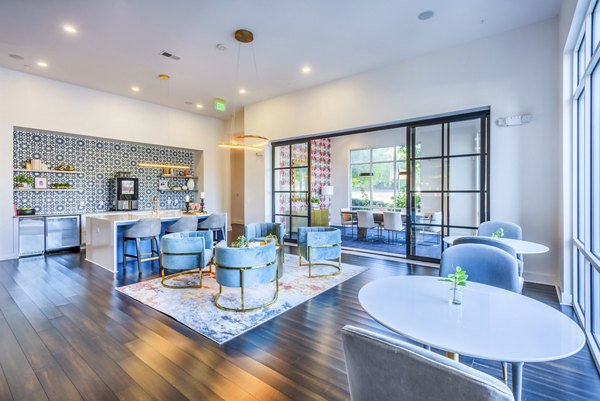 Clubhouse with modern decor and cozy seating at Presley Uptown Apartments, luxury apartments offering premium amenities and vibrant community spaces