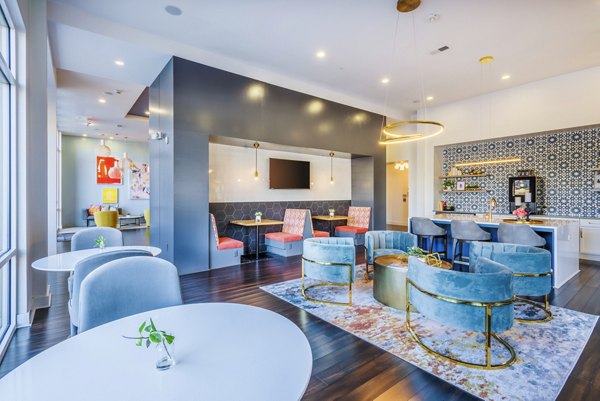 Clubhouse with modern decor and seating areas at Presley Uptown Apartments Enjoy luxury amenities in a vibrant community setting