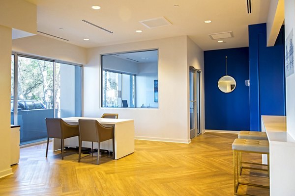 Elegant clubhouse with modern decor at The Cabochon at River Oaks Apartments, perfect for social gatherings and relaxation