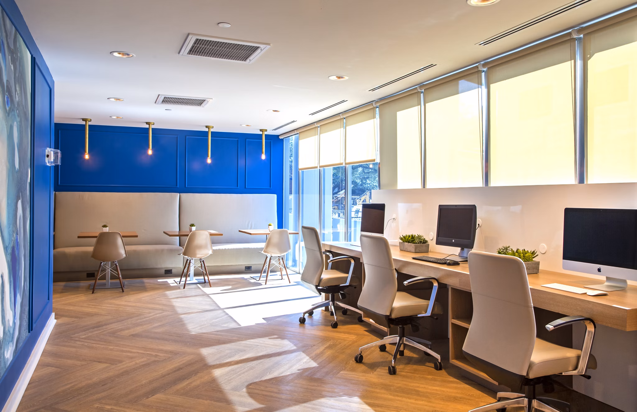 Modern clubhouse with elegant design at The Cabochon at River Oaks Apartments, featuring ample seating and contemporary decor
