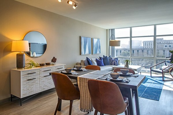 Spacious living room with elegant furnishings at The Cabochon at River Oaks Apartments
