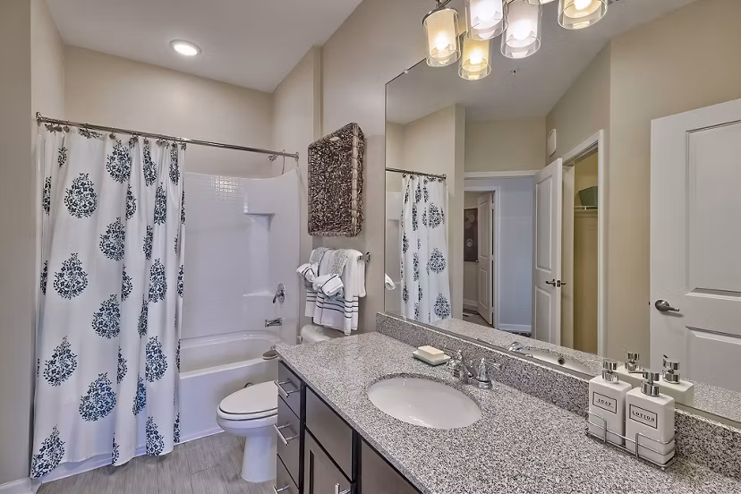 Atlantic at Parkridge Apartments: Modern bathroom with elegant fixtures and marble countertops