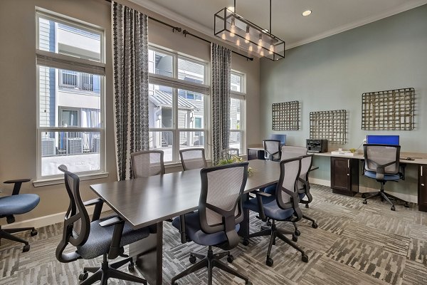 Conference room with advanced AV equipment at Atlantic at Parkridge Apartments, ideal for team meetings and events