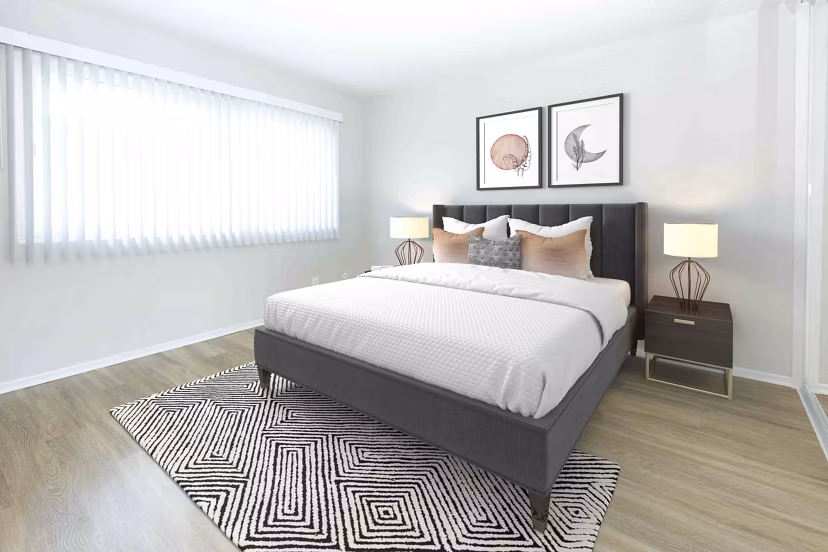 Elegant bedroom featuring expansive windows and modern decor at Madrid Apartments, luxury living by Greystar