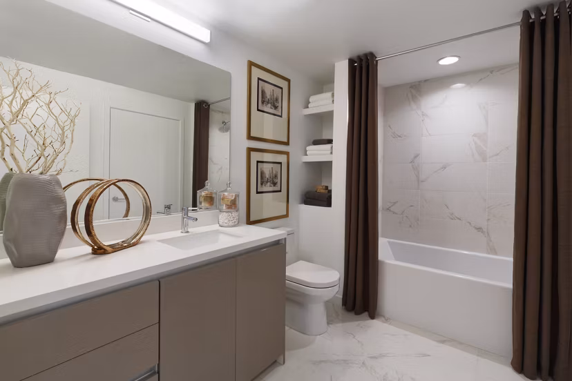 Altana Apartments: Modern bathroom with sleek fixtures and ample storage
