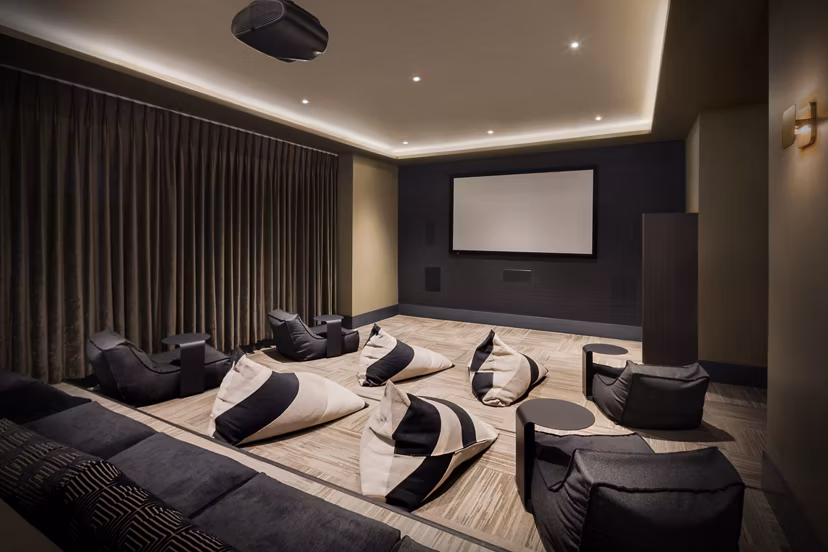 Theater with plush seating and advanced sound system at Altana Apartments