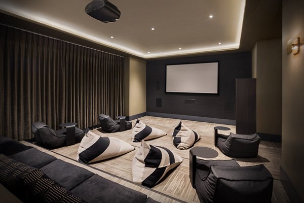 Theater with plush seating and advanced sound system at Altana Apartments