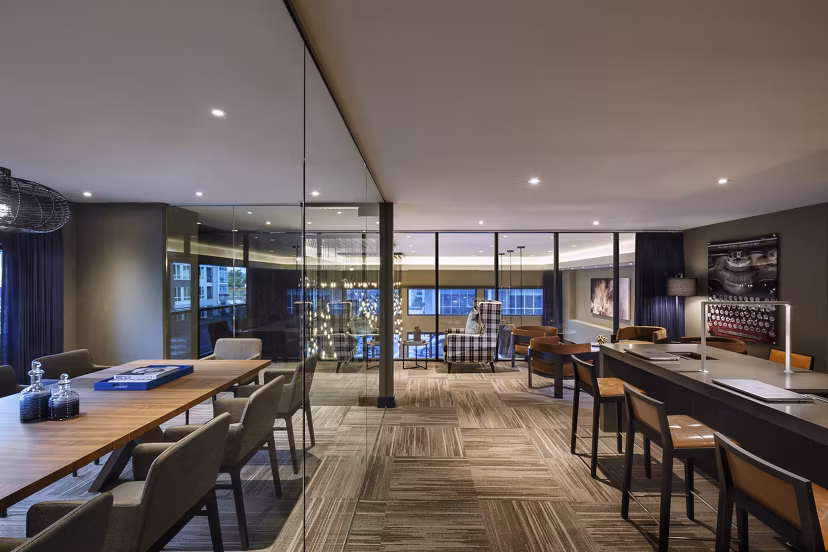Stylish clubhouse with modern decor at Altana Apartments, perfect for community gatherings and events in a luxury living environment