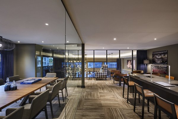 Stylish clubhouse with modern decor at Altana Apartments, perfect for community gatherings and events in a luxury living environment