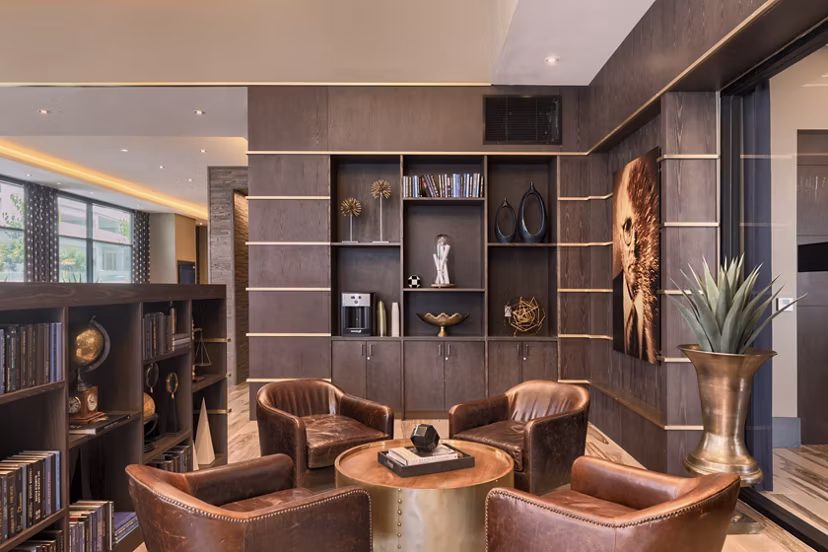 Clubhouse featuring modern design and cozy seating at Altana Apartments
