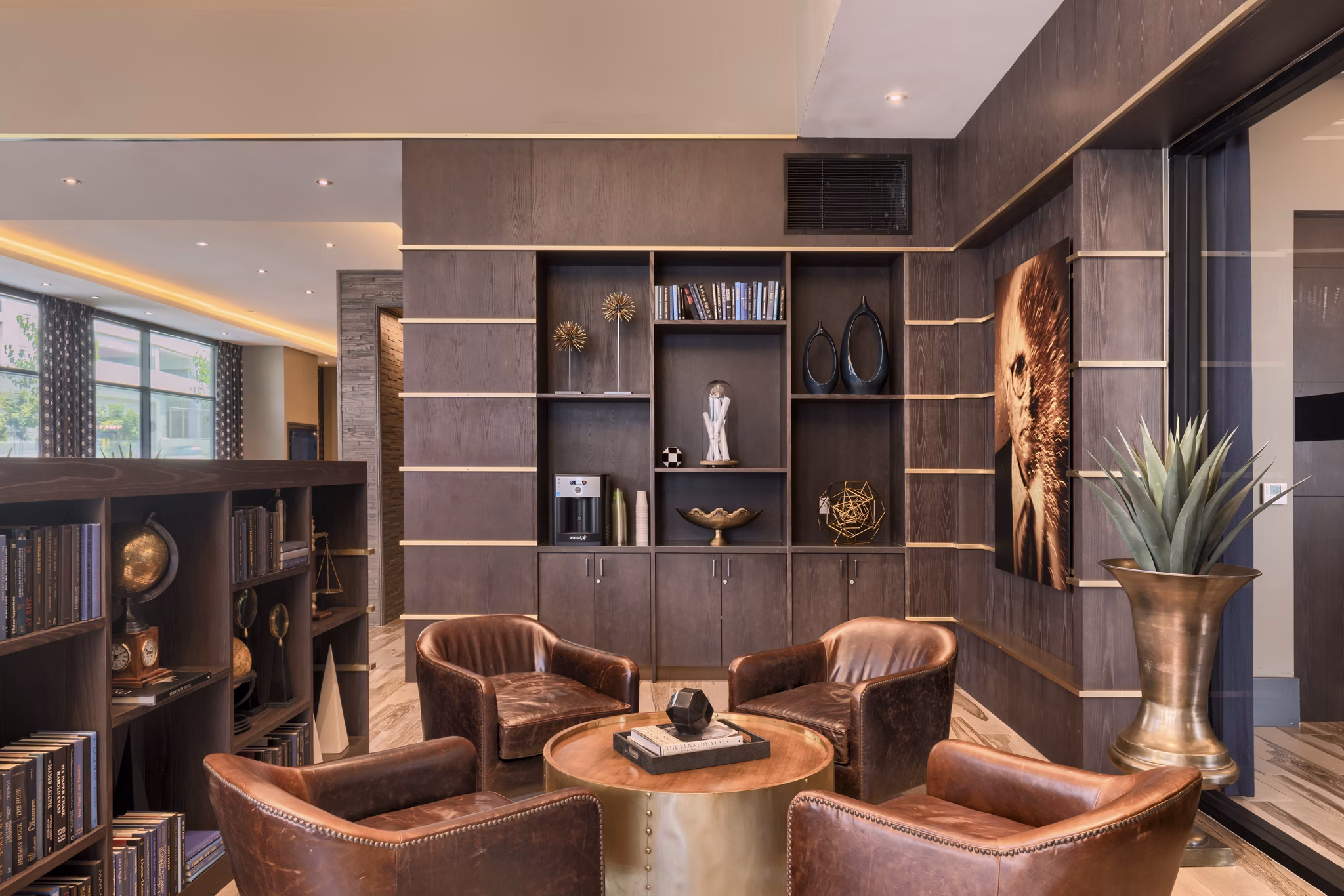 Clubhouse featuring modern design and cozy seating at Altana Apartments