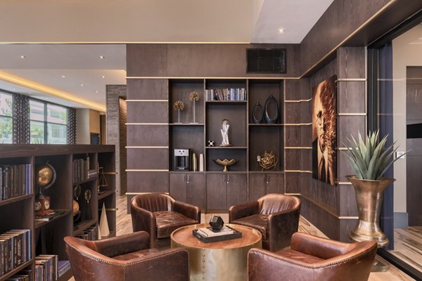 Clubhouse featuring modern design and cozy seating at Altana Apartments