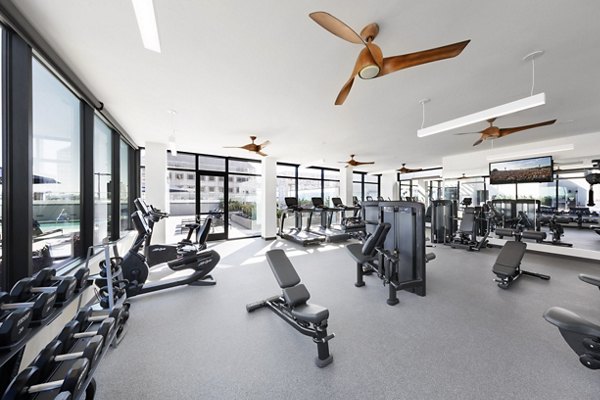 State-of-the-art fitness center with modern equipment at Altana Apartments, offering space for workouts and training sessions