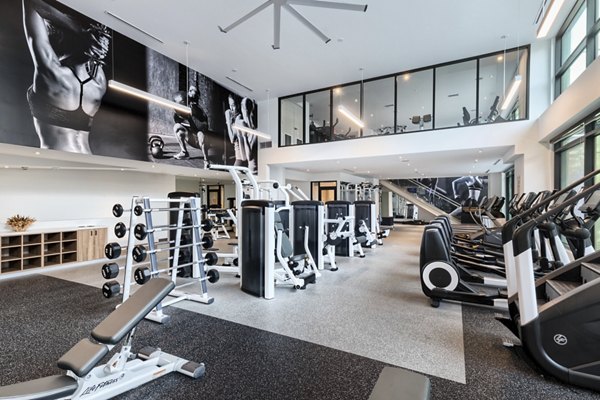 Spacious fitness center with modern equipment at Altana Apartments for luxury living