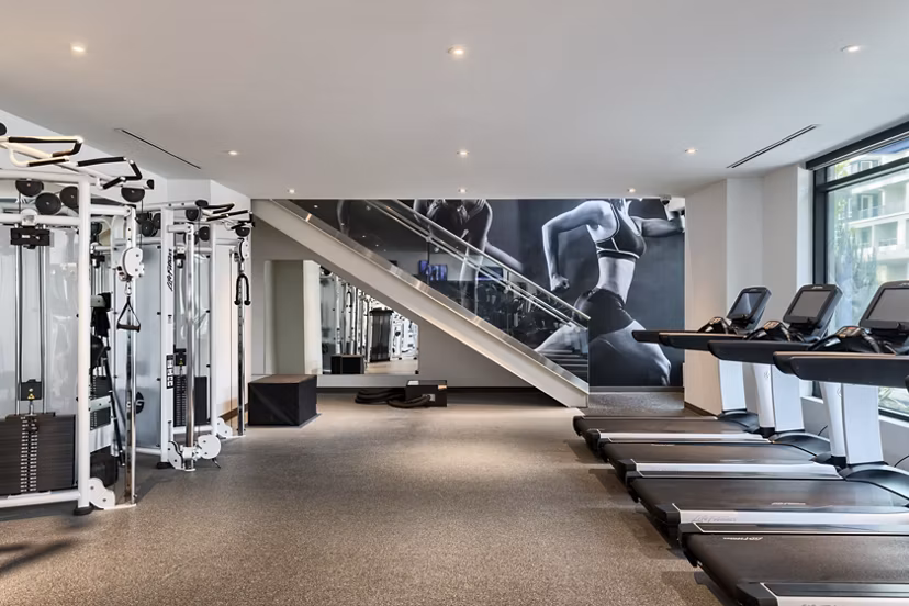 Modern fitness center with state-of-the-art equipment at Altana Apartments
