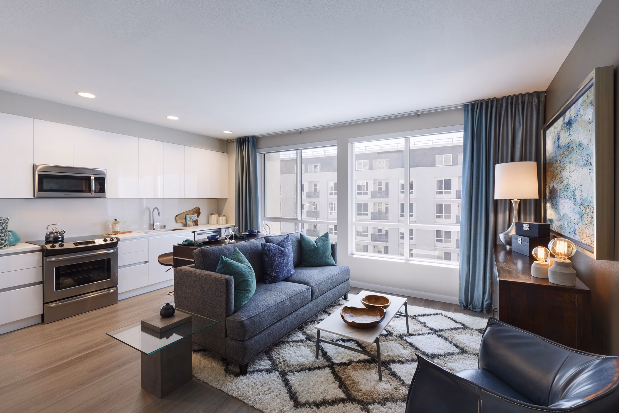 Modern living room with sleek furniture and vibrant decor at Altana Apartments