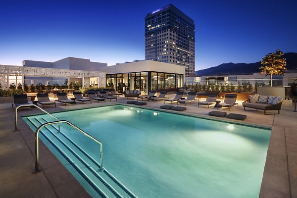 Altana Apartments: Luxury pool with lounge chairs and scenic views