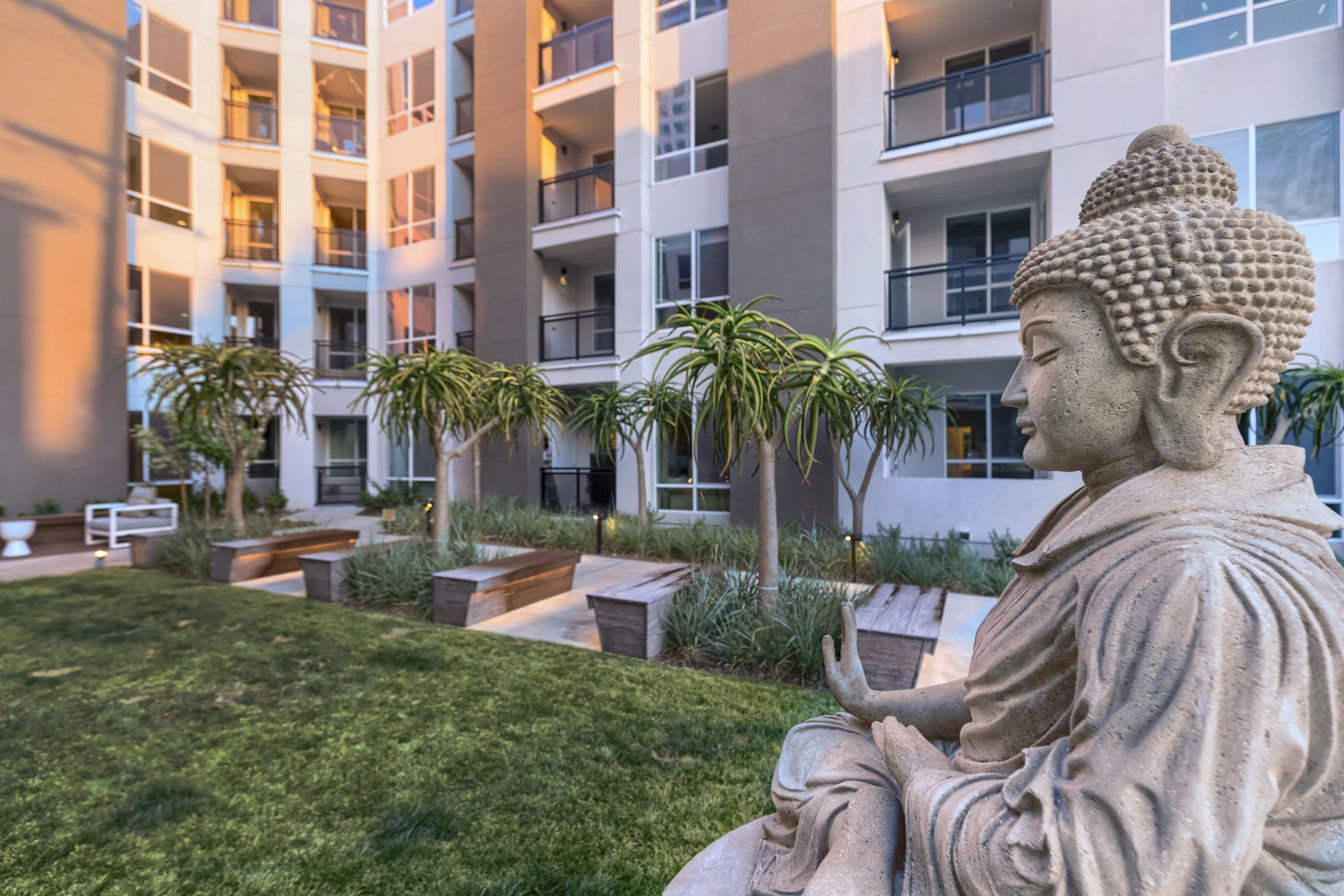 Altana Apartments: Lush courtyard with modern seating area and garden features at luxury community