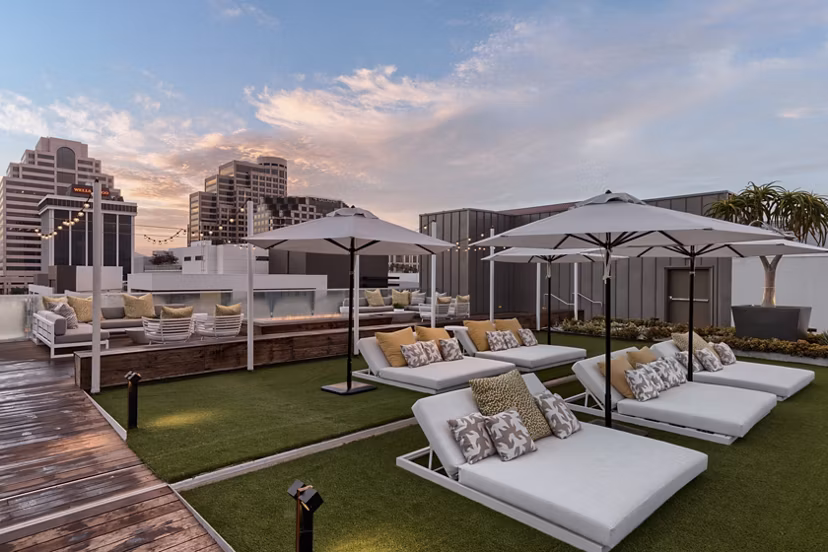 Rooftop deck offering city skyline views at Altana Apartments