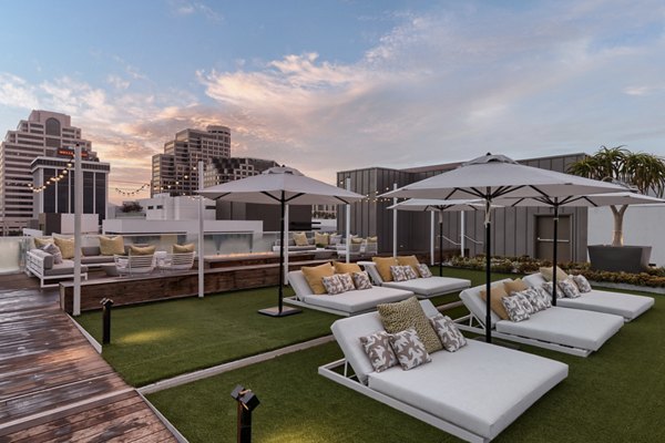 Rooftop deck offering city skyline views at Altana Apartments