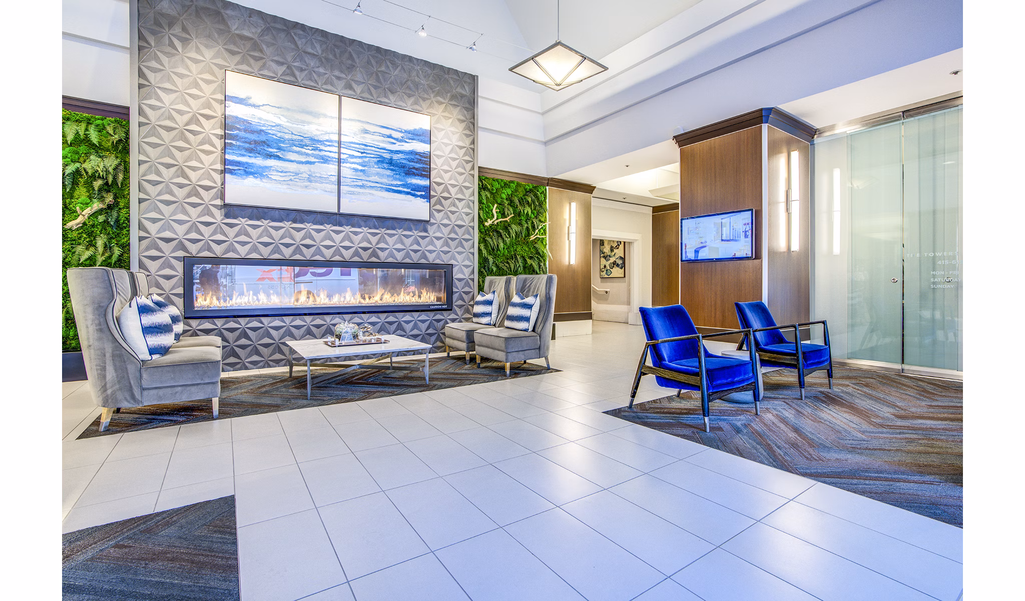 Elegant clubhouse lobby with stylish seating and modern design at The Towers at Rincon Apartments