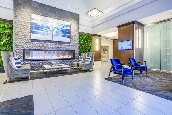 Elegant clubhouse lobby with stylish seating and modern design at The Towers at Rincon Apartments