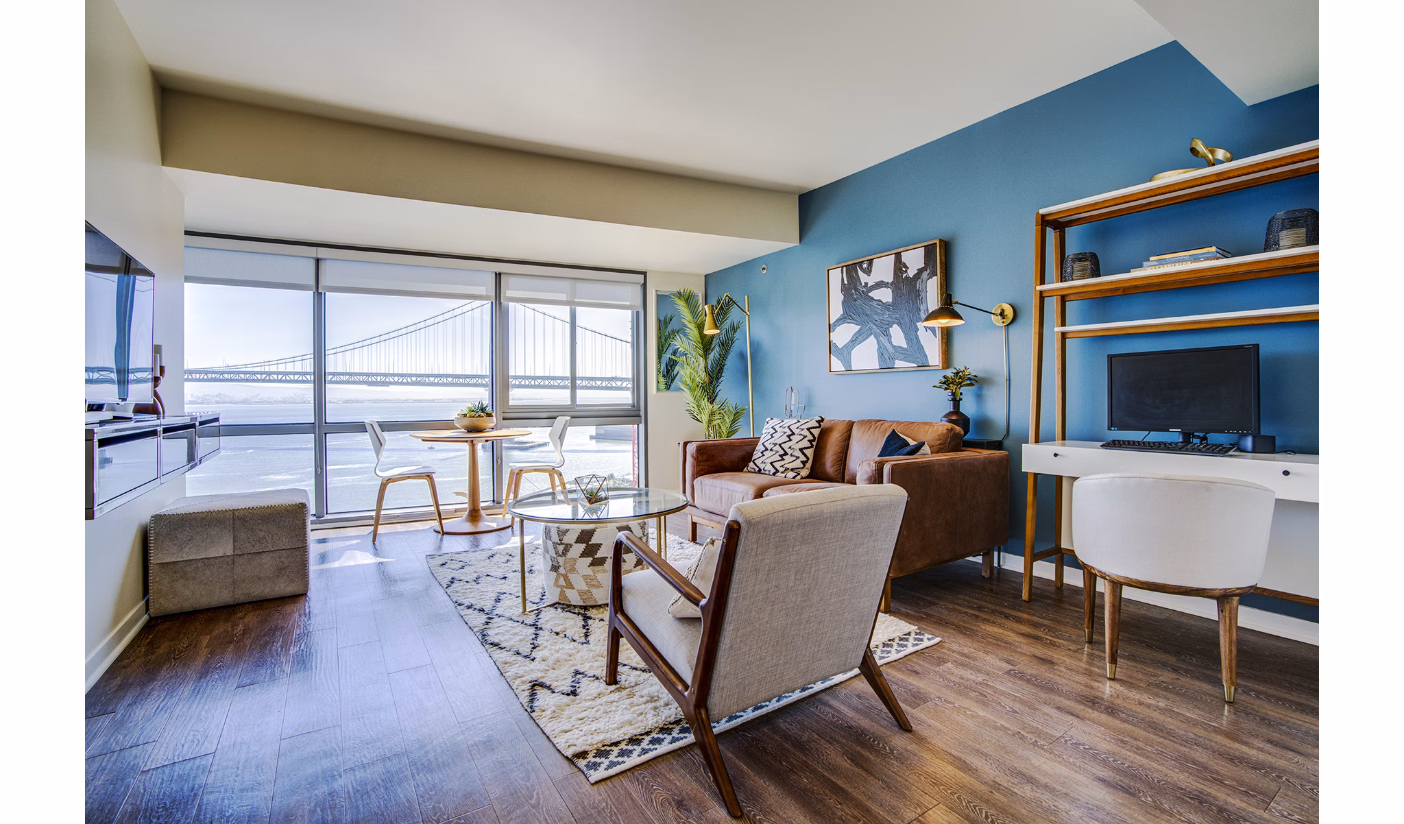Modern living room with city views in The Towers at Rincon Apartments