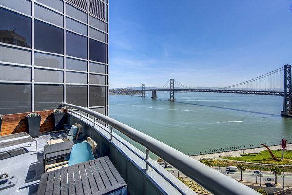 Clubhouse patio featuring comfortable seating at The Towers at Rincon Apartments in San Francisco