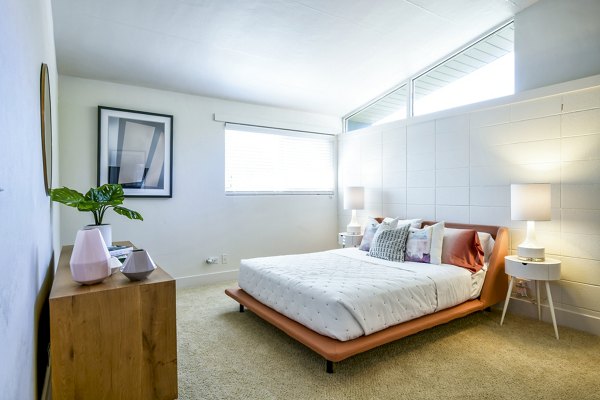 Cozy bedroom with modern decor in Arbors at Antelope Apartments, showcasing luxury living